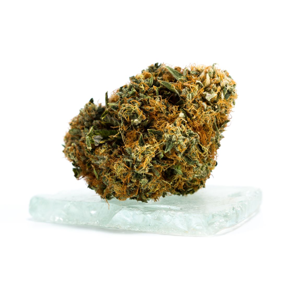 Dense dried cannabis bud with trichomes and orange pistils from Premium Herbs collection