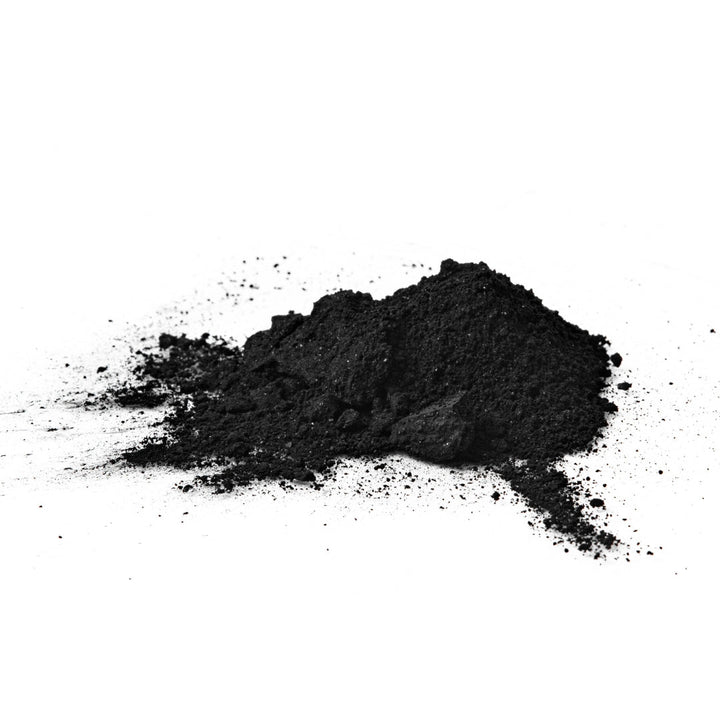 Fine black powder from SuperGreen Powders supports immune health with Juice Powder